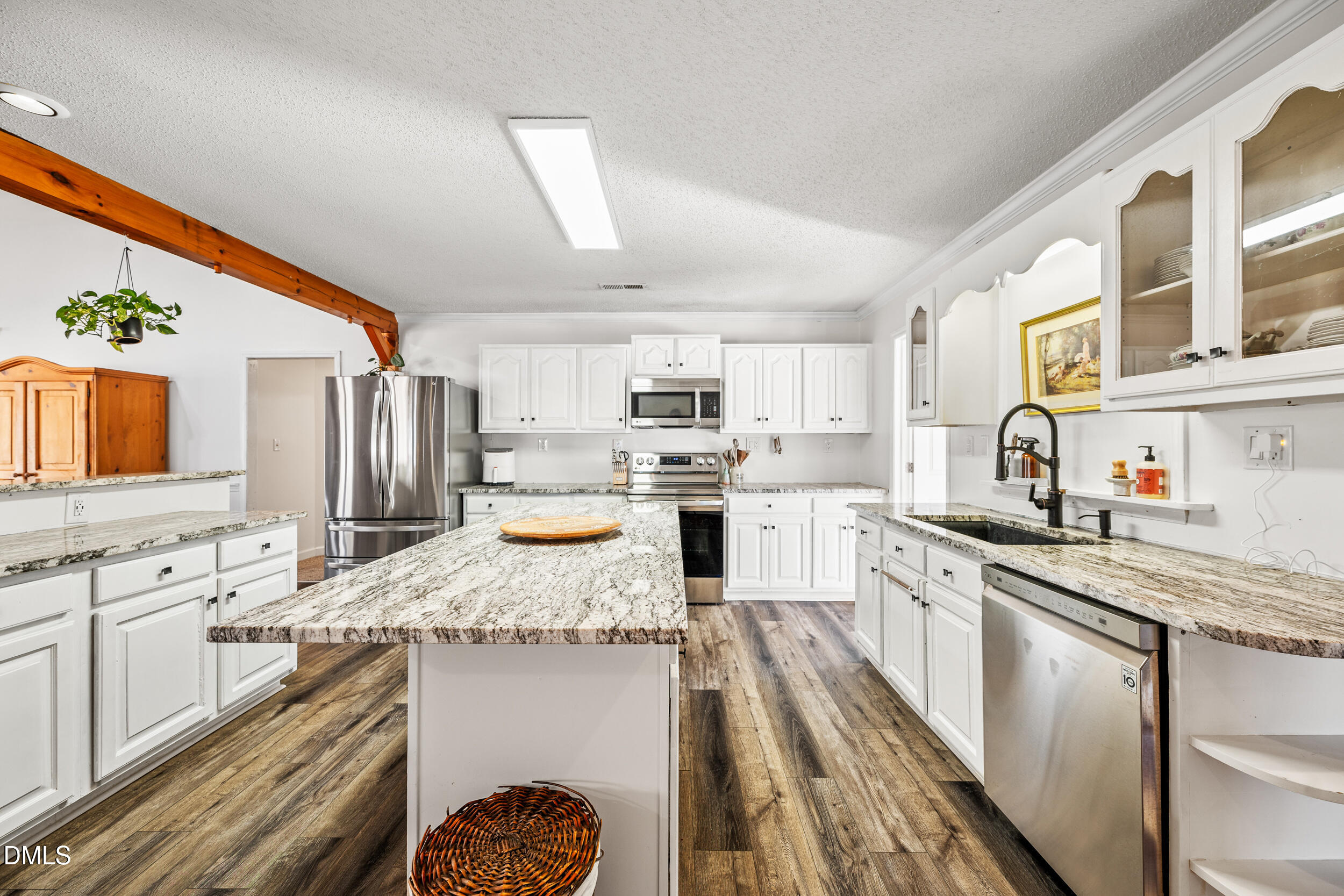 2618 Brame Road Greensboro, NC 27405 - Photo 15 of 64 a kitchen with stainless steel appliances granite countertop a sink stove and refrigerator