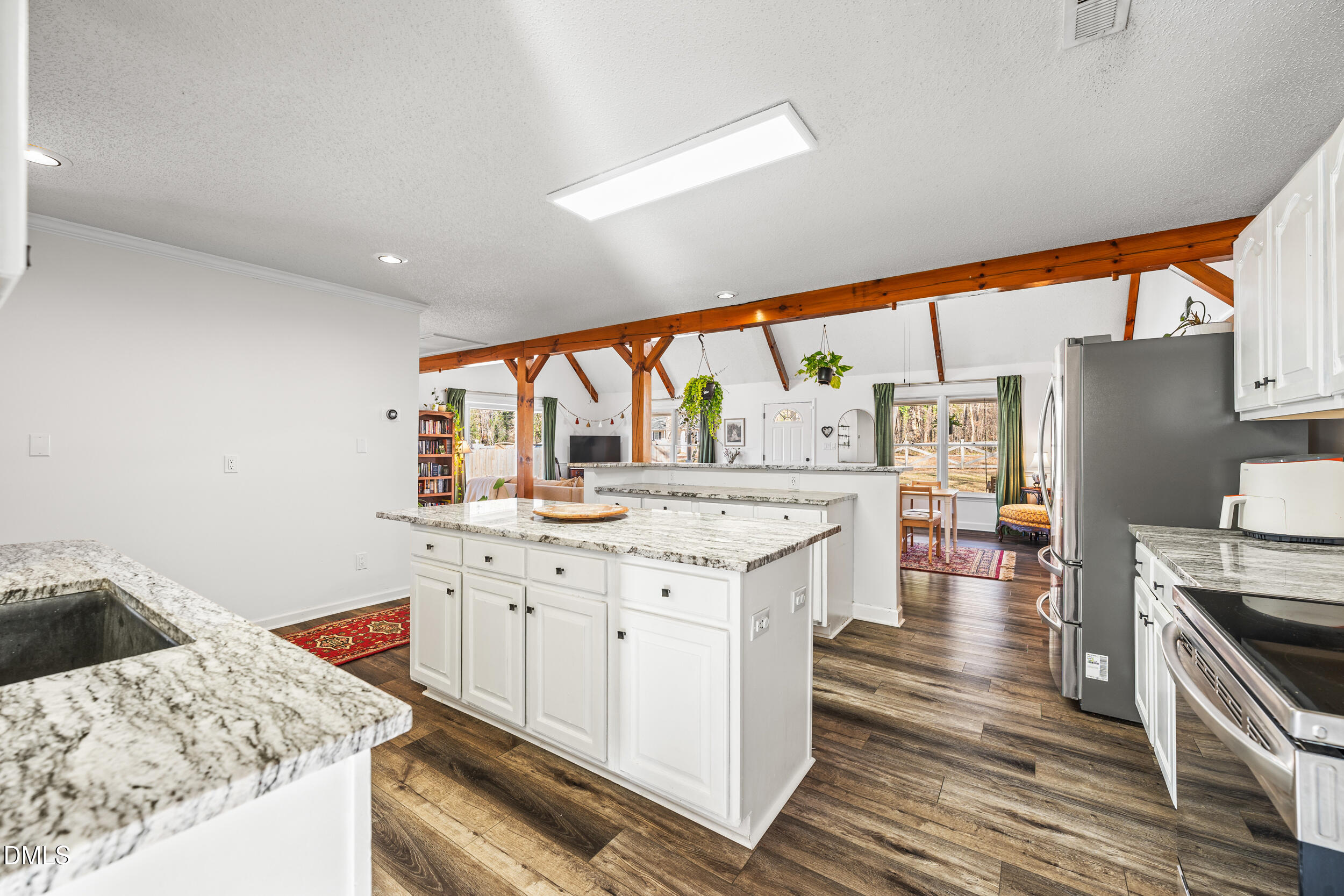 2618 Brame Road Greensboro, NC 27405 - Photo 17 of 64 a kitchen with stainless steel appliances granite countertop a stove and more cabinets