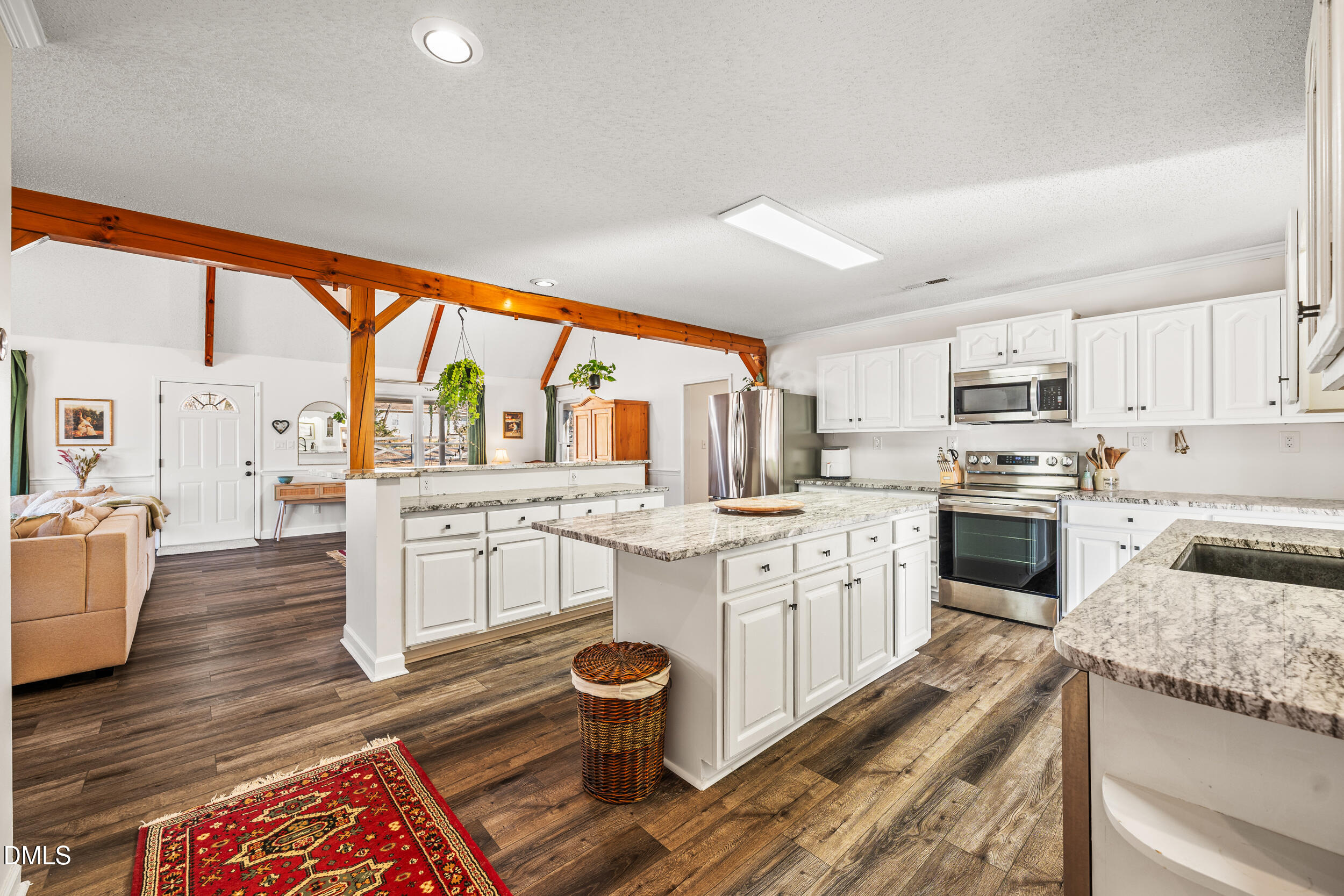 2618 Brame Road Greensboro, NC 27405 - Photo 18 of 64 a kitchen with stainless steel appliances granite countertop a stove a sink and a refrigerator