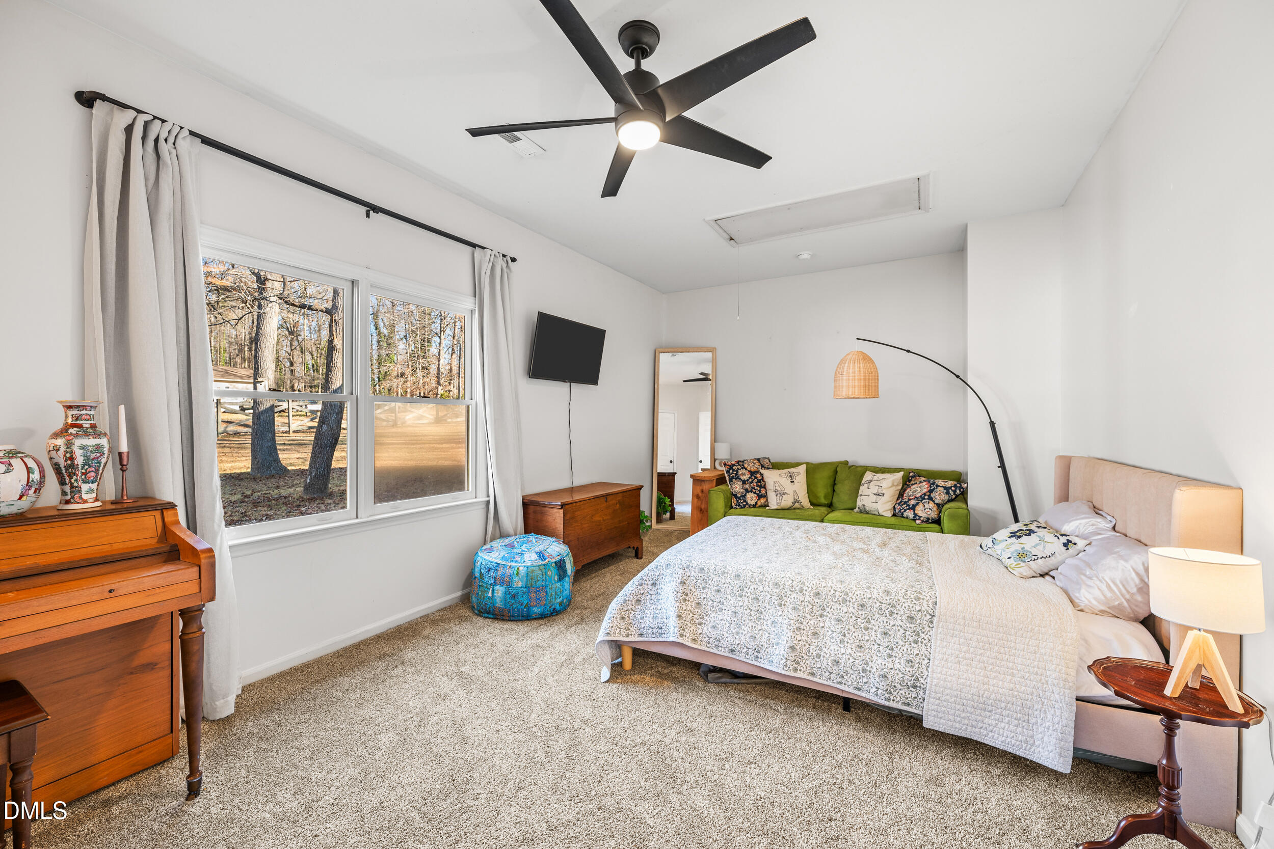 2618 Brame Road Greensboro, NC 27405 - Photo 24 of 64 a bedroom with a bed and a chandelier