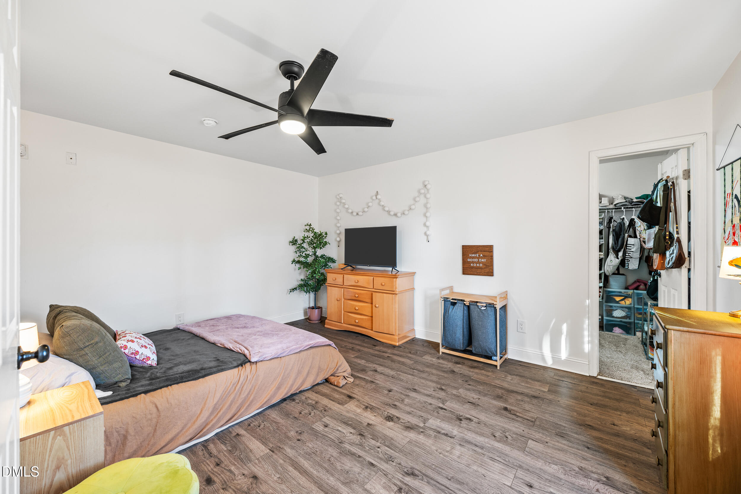 2618 Brame Road Greensboro, NC 27405 - Photo 32 of 64 a bedroom with a bed and wooden floor