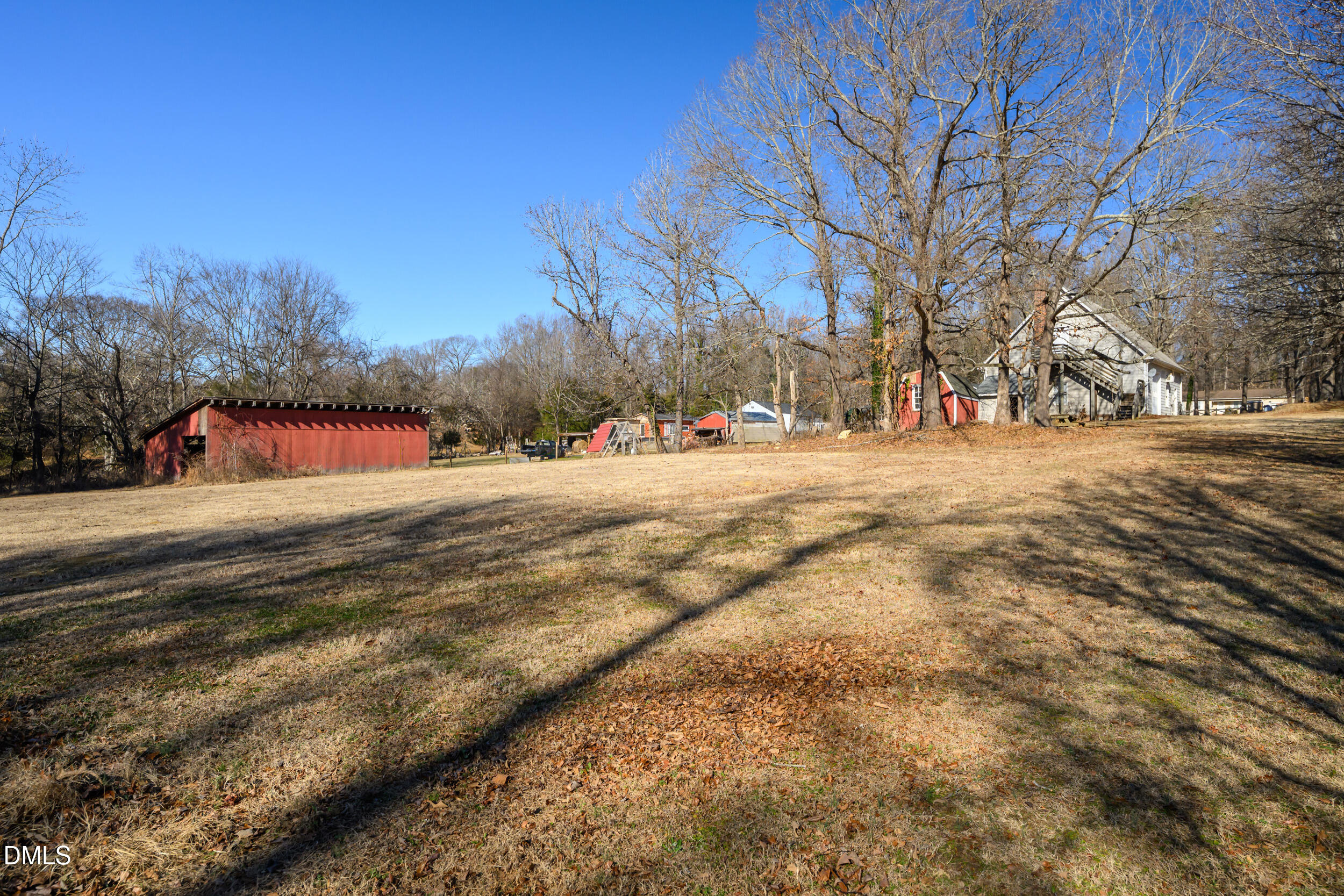 2618 Brame Road Greensboro, NC 27405 - Photo 44 of 64 a view of dirt yard with a large tree