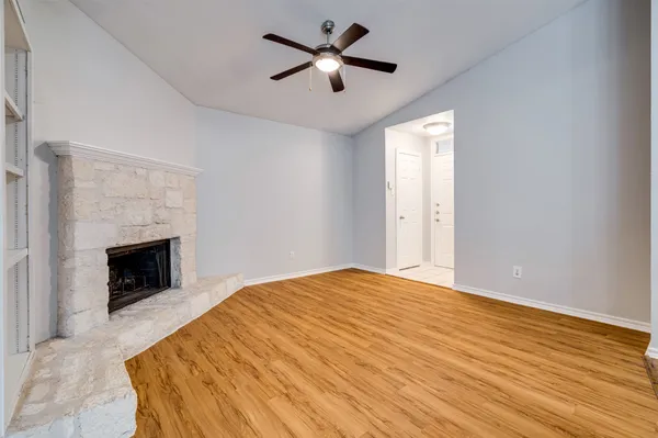 a bedroom with a bed and a fireplace