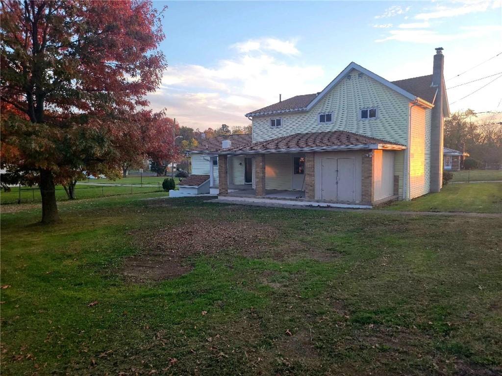 51 Sheldon Avenue Fairchance, PA 15436 - Photo 17 of 18 a large house with a big yard and large trees