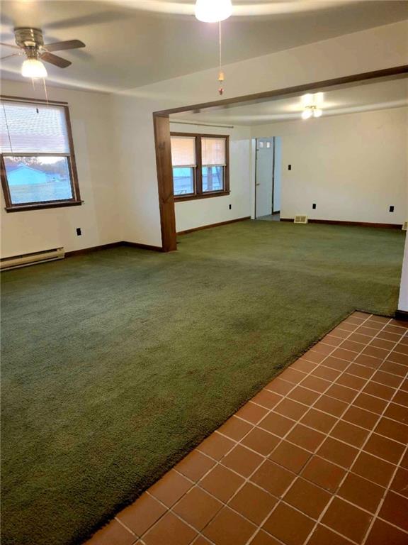 51 Sheldon Avenue Fairchance, PA 15436 - Photo 2 of 18 a view of an empty room with a window and wooden floor