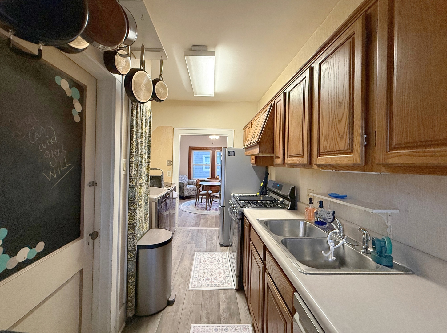 621 24th Avenue Moline, IL 61265 - Photo 16 of 31 a kitchen with a sink a stove and cabinets