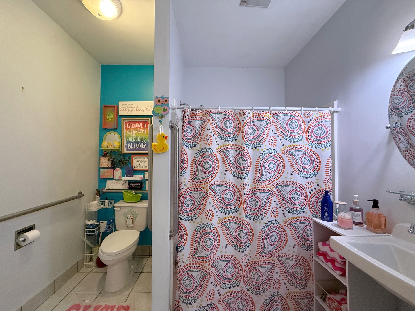 621 24th Avenue Moline, IL 61265 - Photo 18 of 31 a bathroom with a toilet and a shower curtain