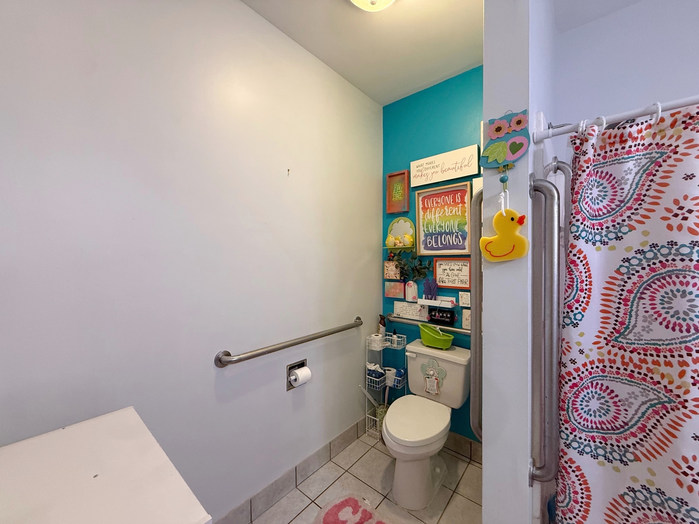621 24th Avenue Moline, IL 61265 - Photo 19 of 31 a bathroom with a toilet and a shower curtain