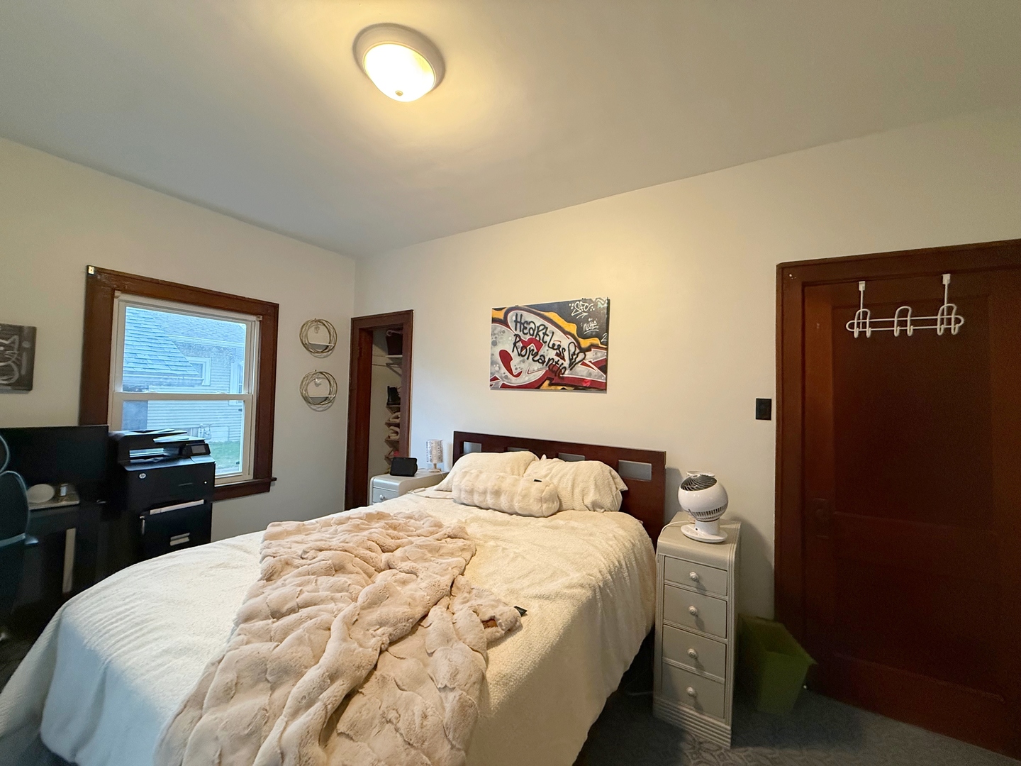 621 24th Avenue Moline, IL 61265 - Photo 21 of 31 a bedroom with a bed and a table in it