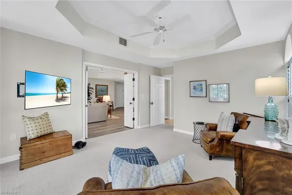 a living room with furniture and a lamp