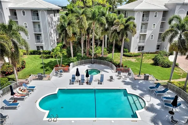 a view of a swimming pool with a patio