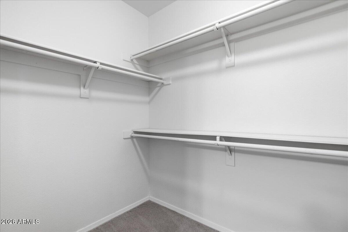 1825 West Ray Road, Unit 1106 Chandler, AZ 85224 - Photo 19 of 62 a view of a room with racks on the wall