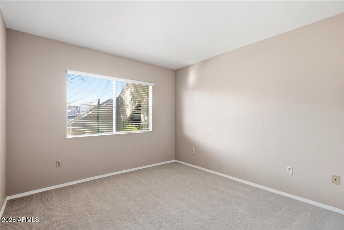 1825 West Ray Road, Unit 1106 Chandler, AZ 85224 - Photo 21 of 62 an empty room with a window