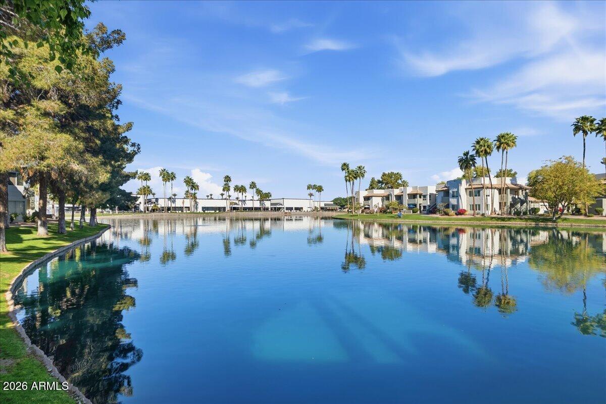 1825 West Ray Road, Unit 1106 Chandler, AZ 85224 - Photo 32 of 62 a view of a lake with houses