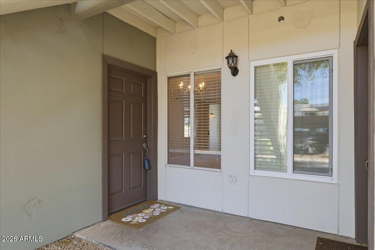 1825 West Ray Road, Unit 1106 Chandler, AZ 85224 - Photo 3 of 62 a view of an entryway with wooden floor
