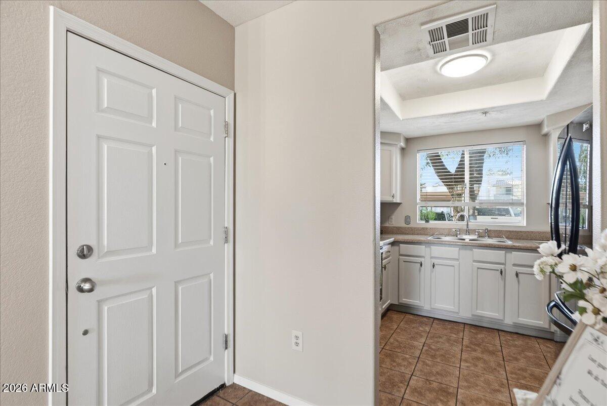 1825 West Ray Road, Unit 1106 Chandler, AZ 85224 - Photo 4 of 62 a bathroom with a granite countertop sink and a mirror