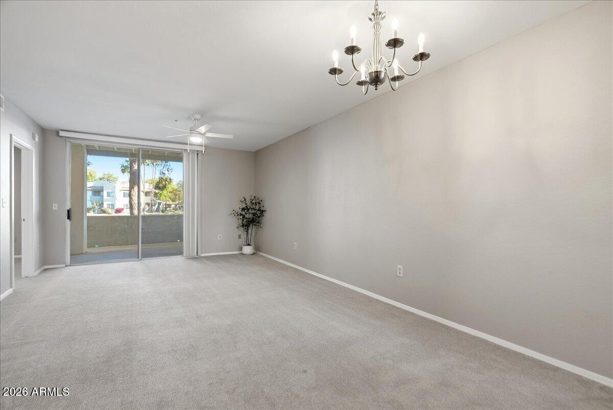 1825 West Ray Road, Unit 1106 Chandler, AZ 85224 - Photo 8 of 62 wooden floor in an empty room with a window