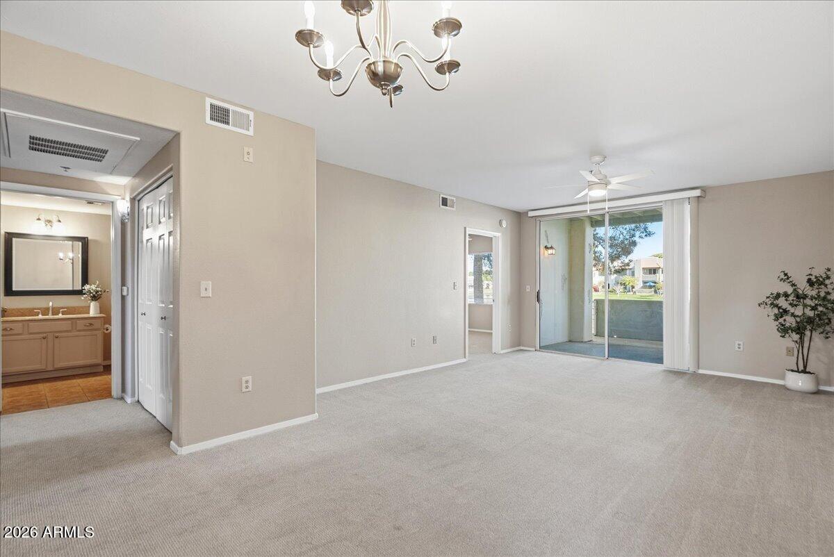 1825 West Ray Road, Unit 1106 Chandler, AZ 85224 - Photo 9 of 62 a view of an empty room with a window