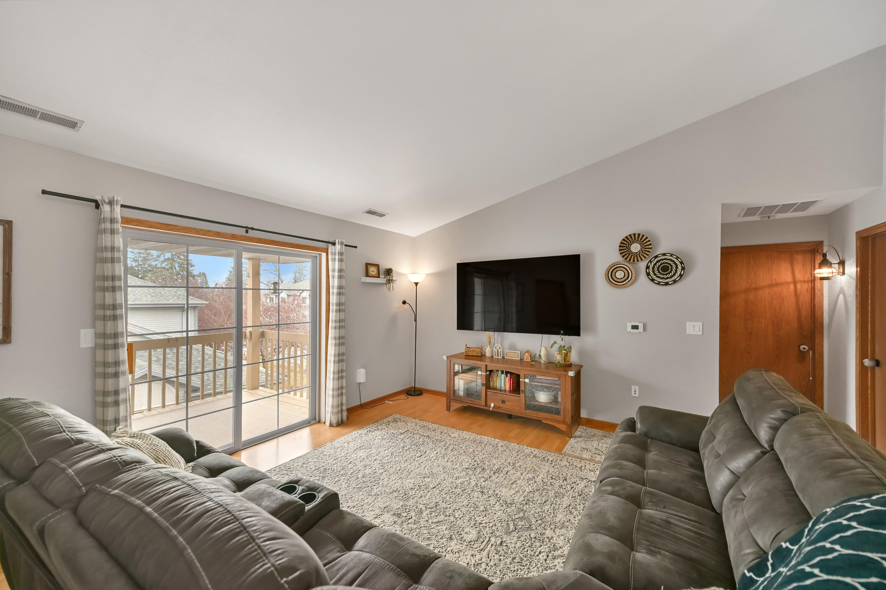9332 West Loomis Road, Unit 6 Franklin, WI 53132 - Photo 4 of 26 Great Room w/ Vaulted Ceiling