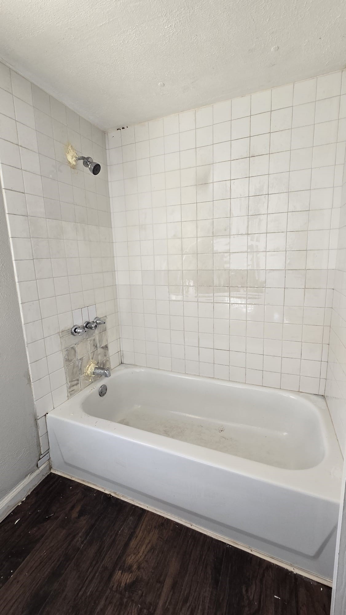 18509 Blake Manor Road Manor, TX 78653 - Photo 8 of 17 a bathroom with a bathtub and a shower