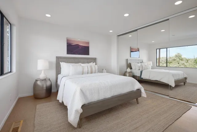 a bedroom with bed and window