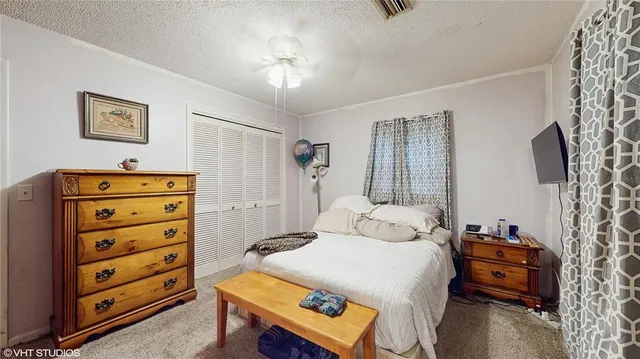 a bedroom with a bed and a dresser