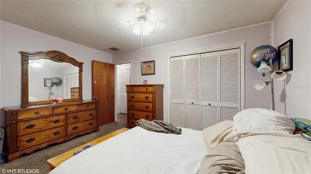 a bedroom with a bed and a dresser