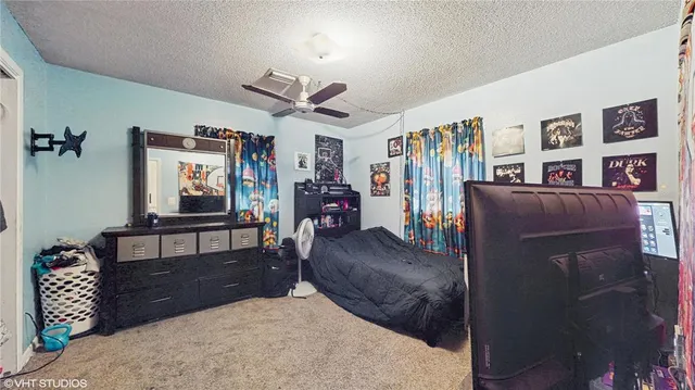 a bedroom with furniture and a bed