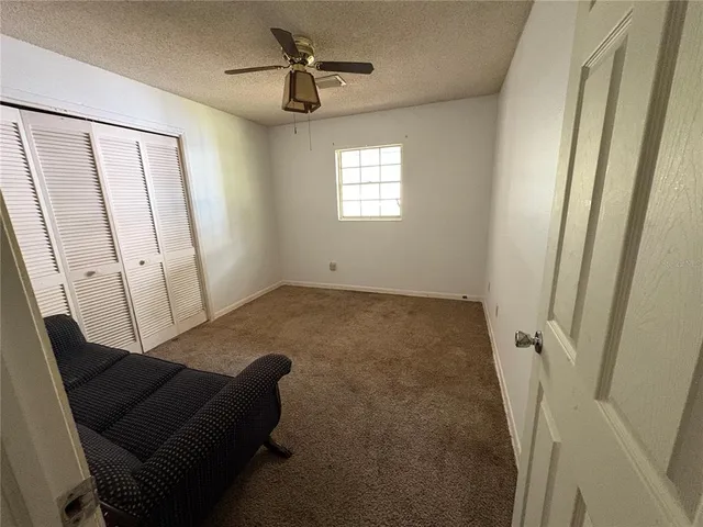 a bedroom with two beds and a window