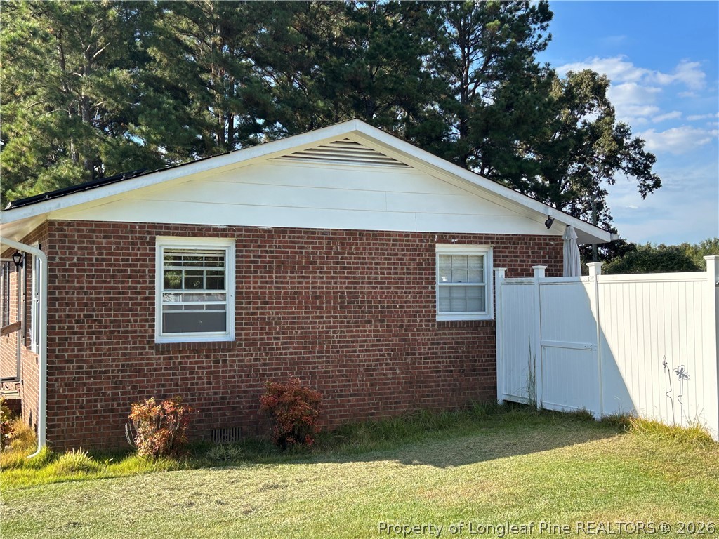 754 Horne Road Rowland, NC 28383 - Photo 4 of 13 Side View with Fence