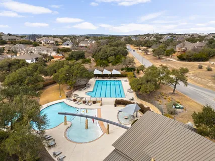 an aerial view of residential houses with outdoor space