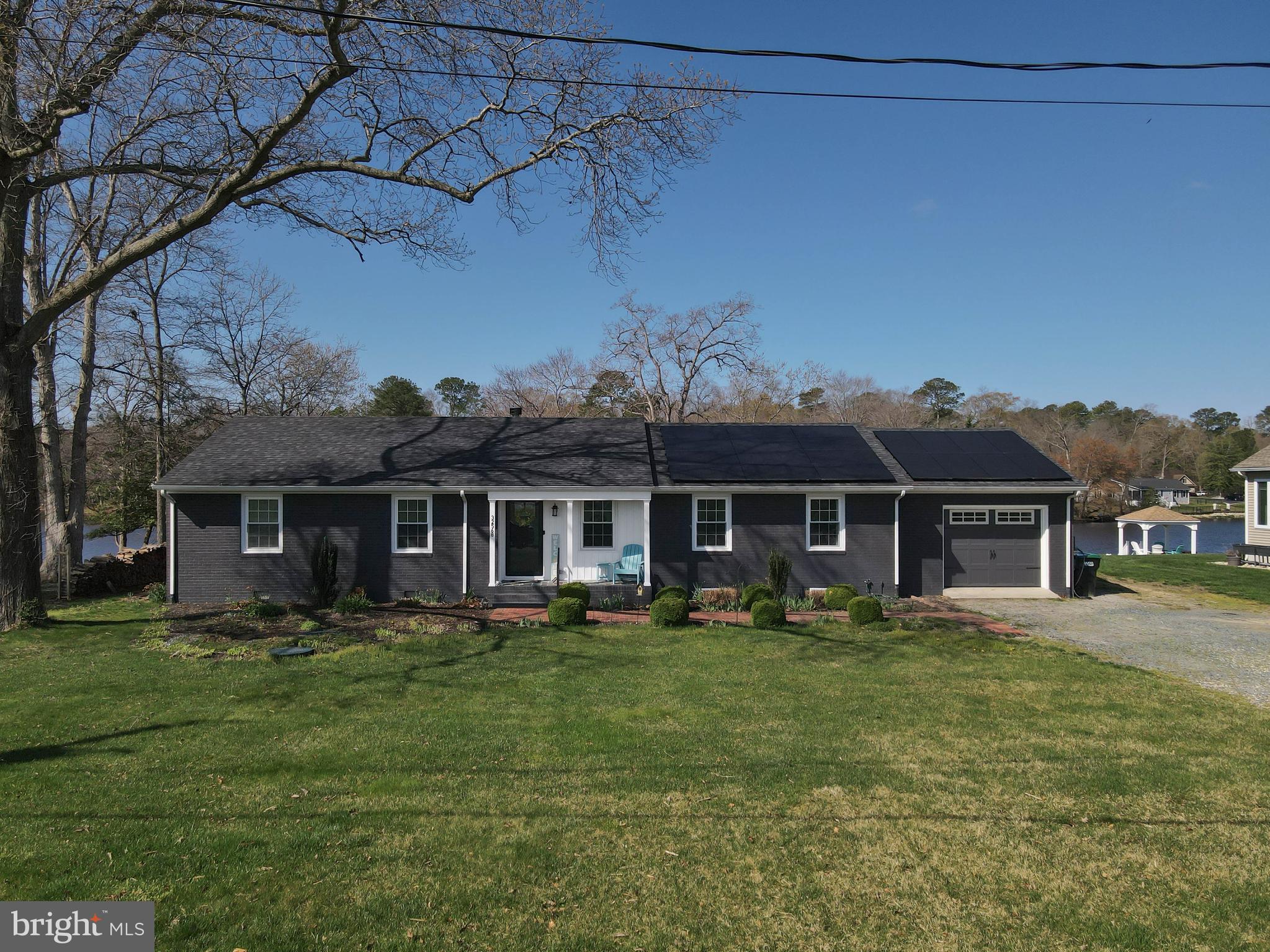 32568 Hastings Drive Laurel, DE 19956 - Photo 1 of 43 a front view of a house with a garden