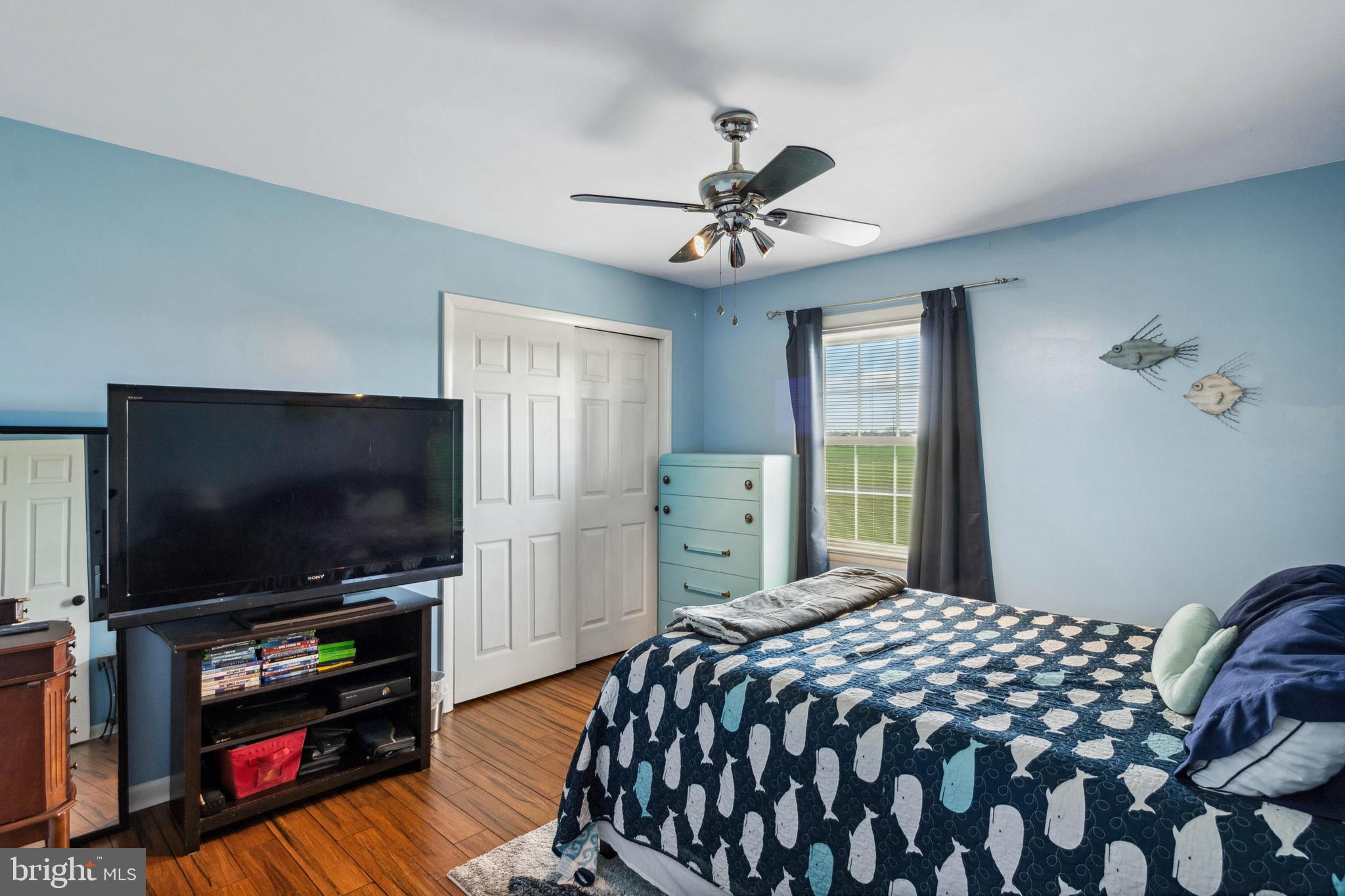 32568 Hastings Drive Laurel, DE 19956 - Photo 18 of 43 a bedroom with a bed and a flat screen tv
