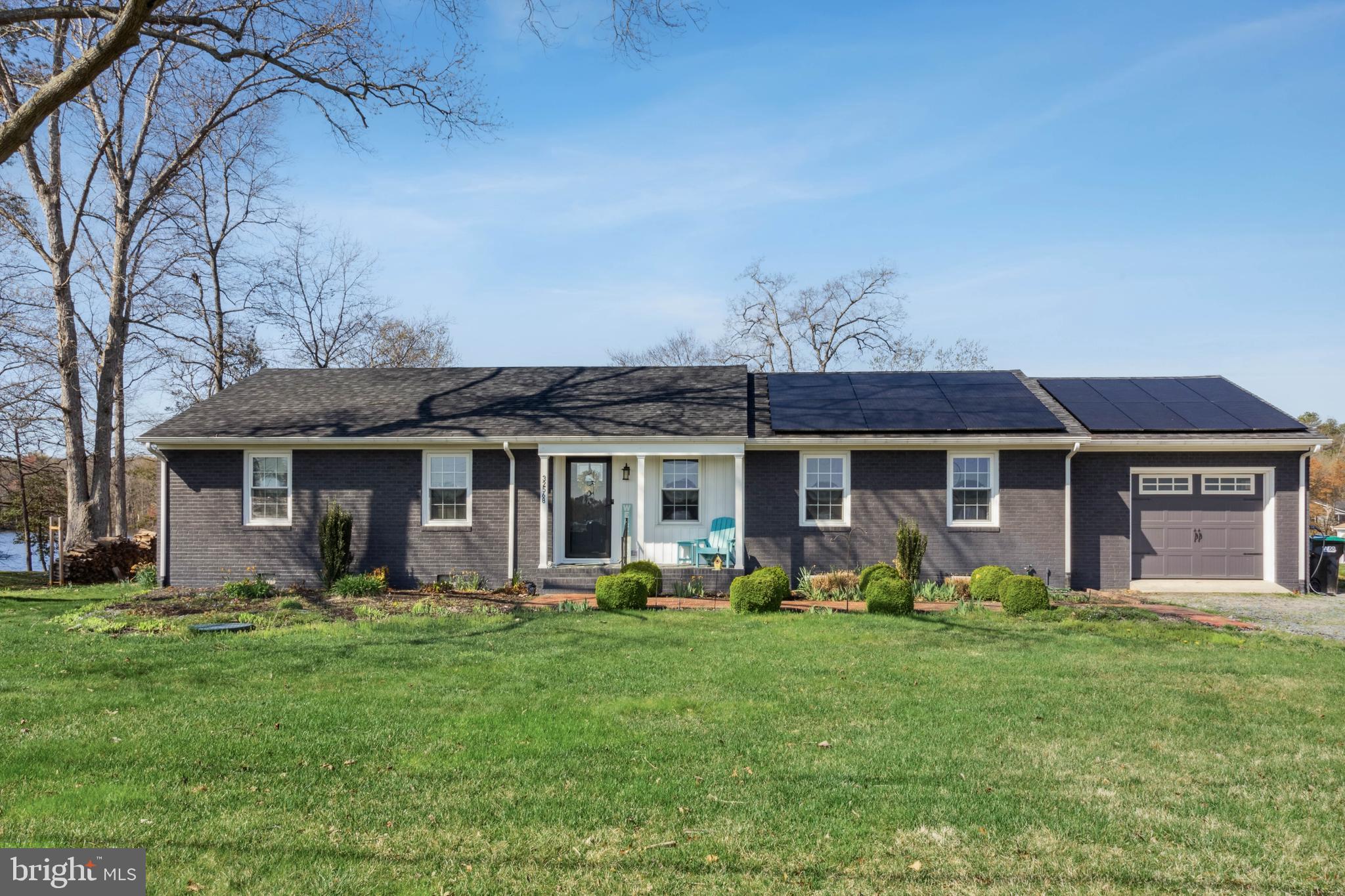 32568 Hastings Drive Laurel, DE 19956 - Photo 34 of 43 a front view of a house with garden and porch