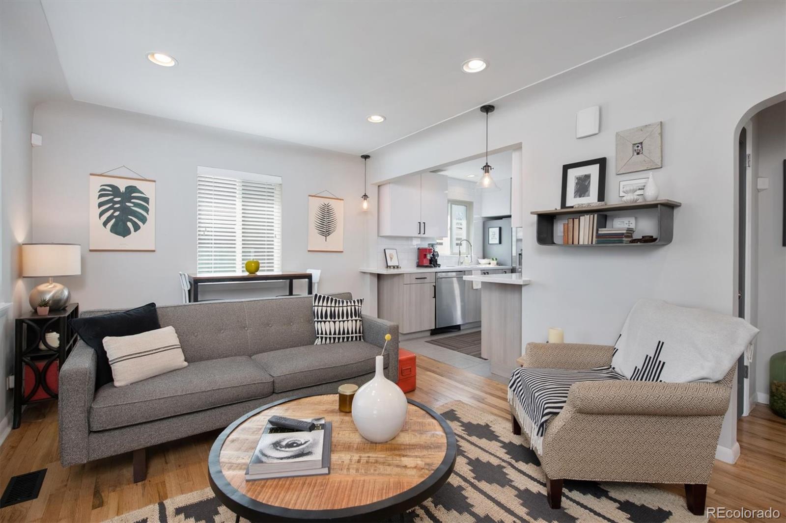 2745 King Street Denver, CO 80211 - Photo 4 of 24 a living room with furniture and kitchen view