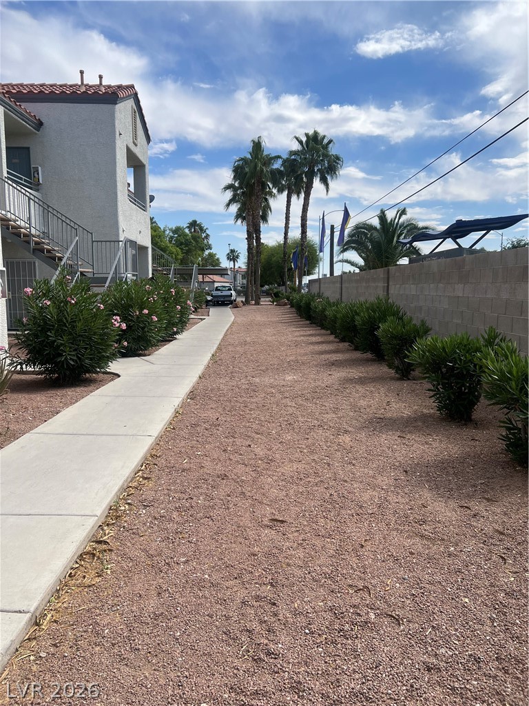 3318 North Decatur Boulevard, Unit 1174 Las Vegas, NV 89130 - Photo 18 of 23 This building features modern architecture and a beautiful exterior, enhanced by well-maintained landscaping.