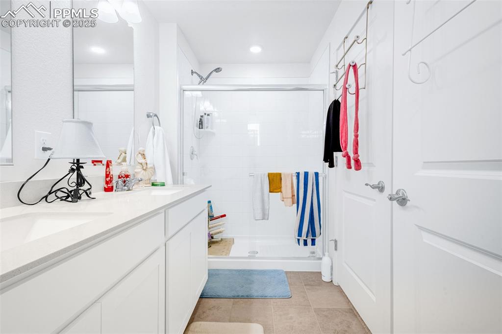 2325 Coyote Mint Drive Monument, CO 80132 - Photo 14 of 26 a bathroom with a sink and a tub