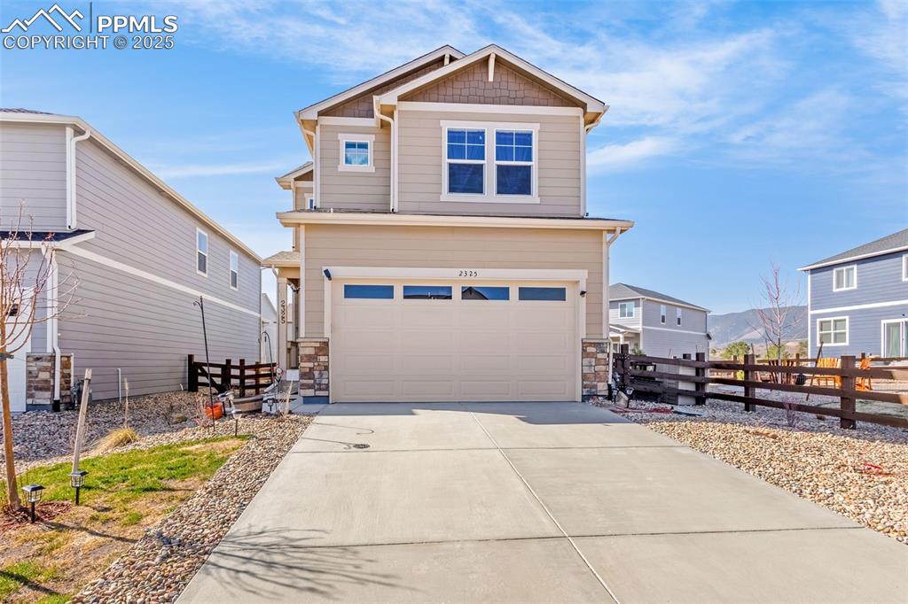 2325 Coyote Mint Drive Monument, CO 80132 - Photo 2 of 26 a front view of a house with a yard