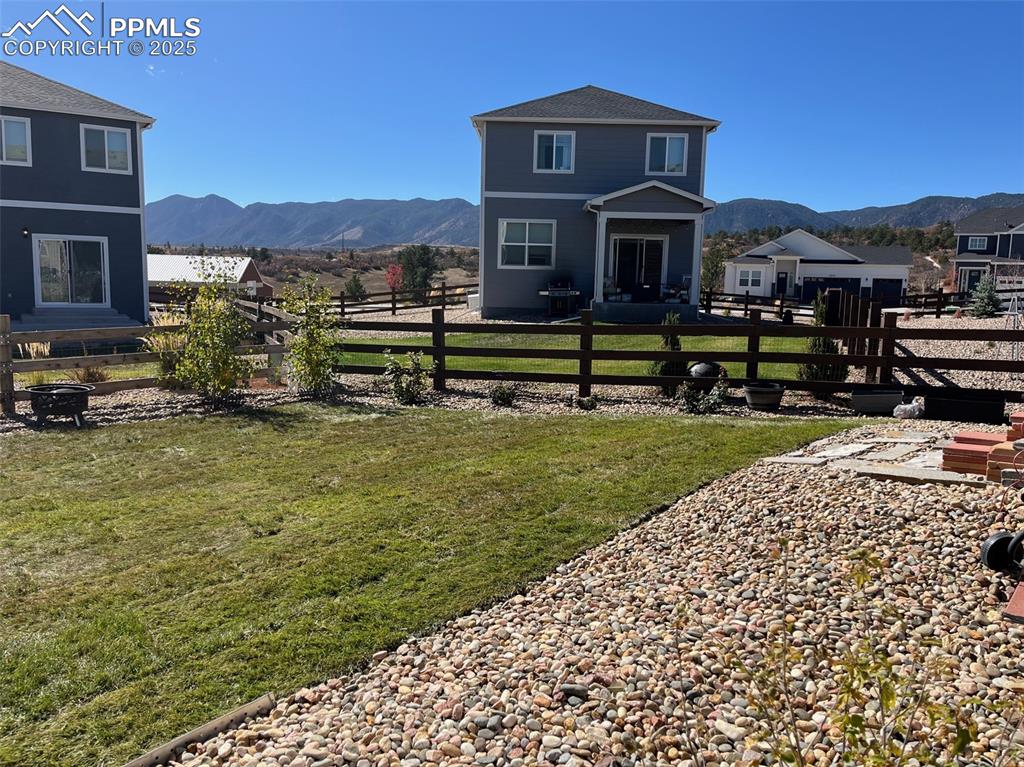 2325 Coyote Mint Drive Monument, CO 80132 - Photo 24 of 26 a view of a house with a yard