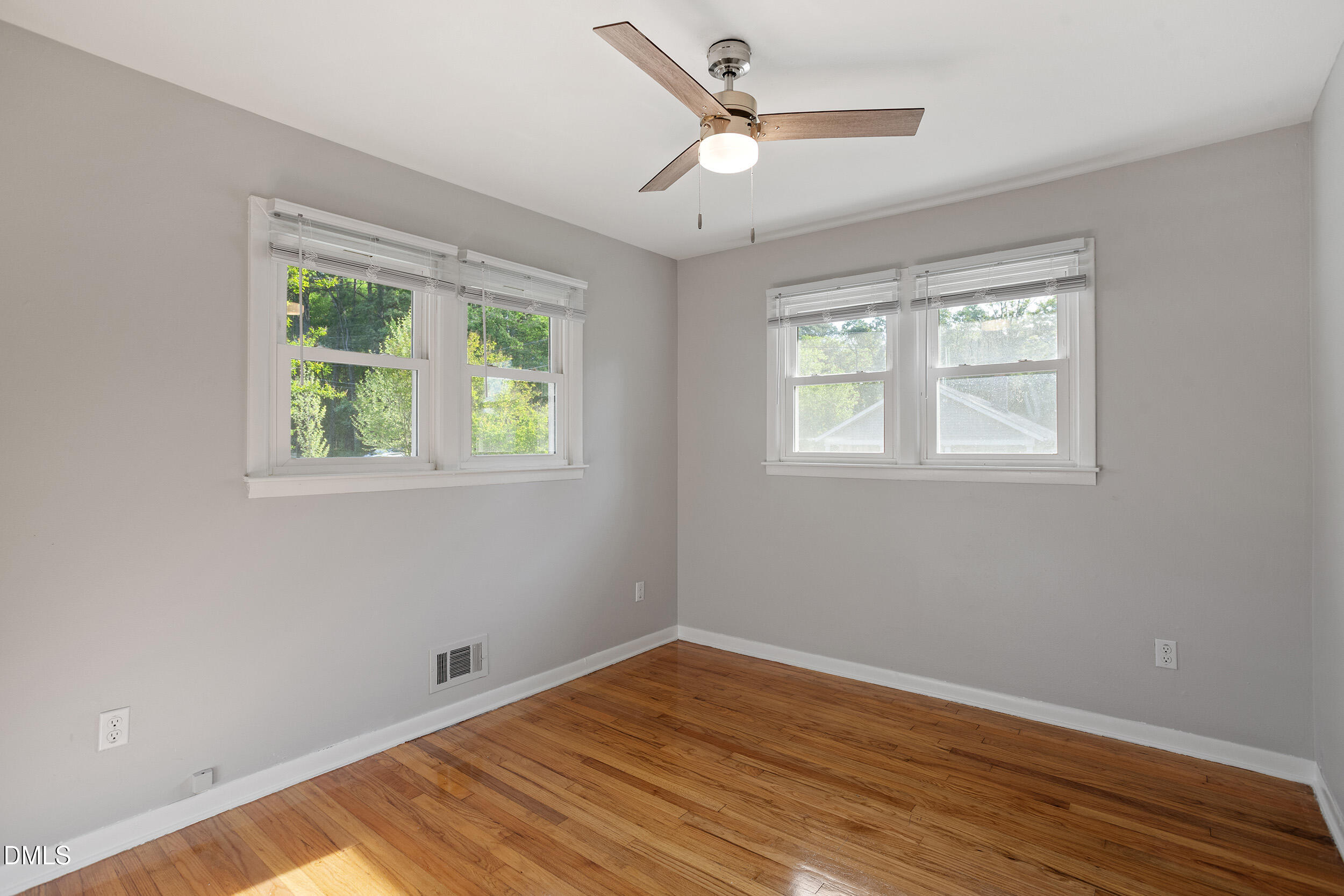 2414 Chapin Street Durham, NC 27707 - Photo 23 of 30 a view of empty room with wooden floor and fan