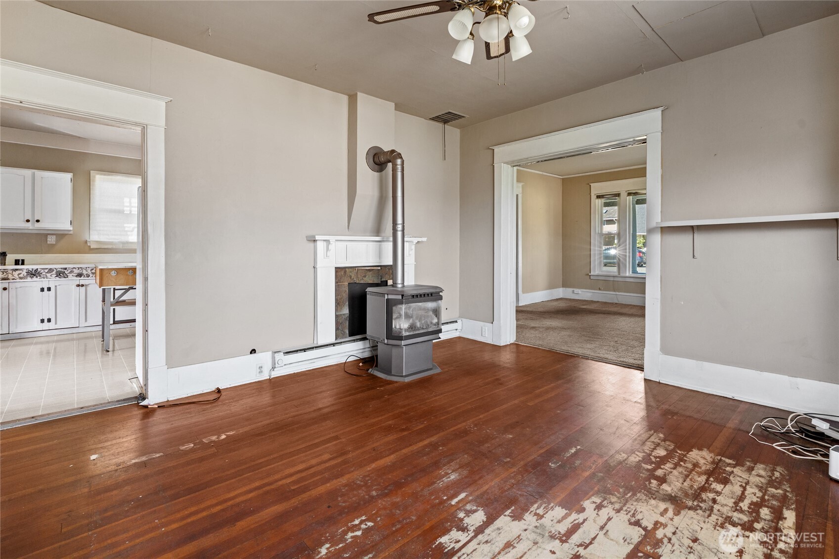 1118 Thompson Street Sumner, WA 98390 - Photo 11 of 39 a view of empty room with wooden floor and fan