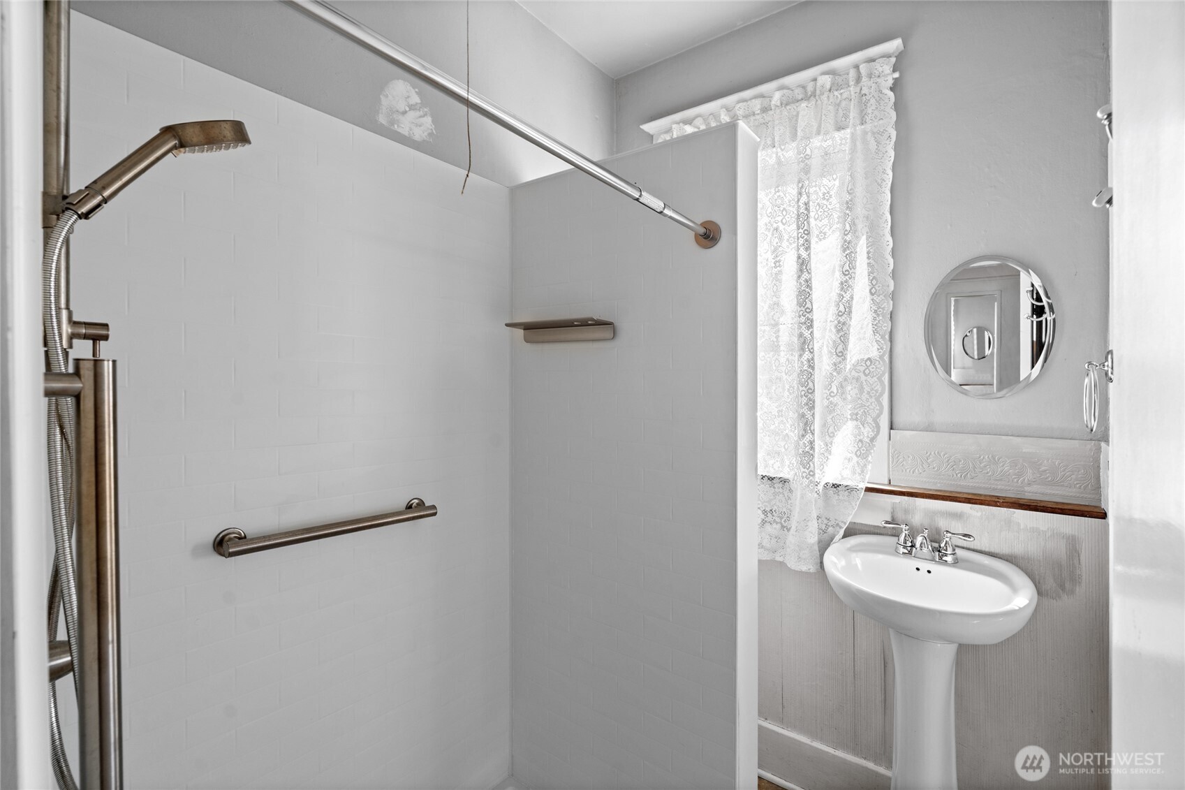 1118 Thompson Street Sumner, WA 98390 - Photo 12 of 39 a bathroom with a sink and mirror