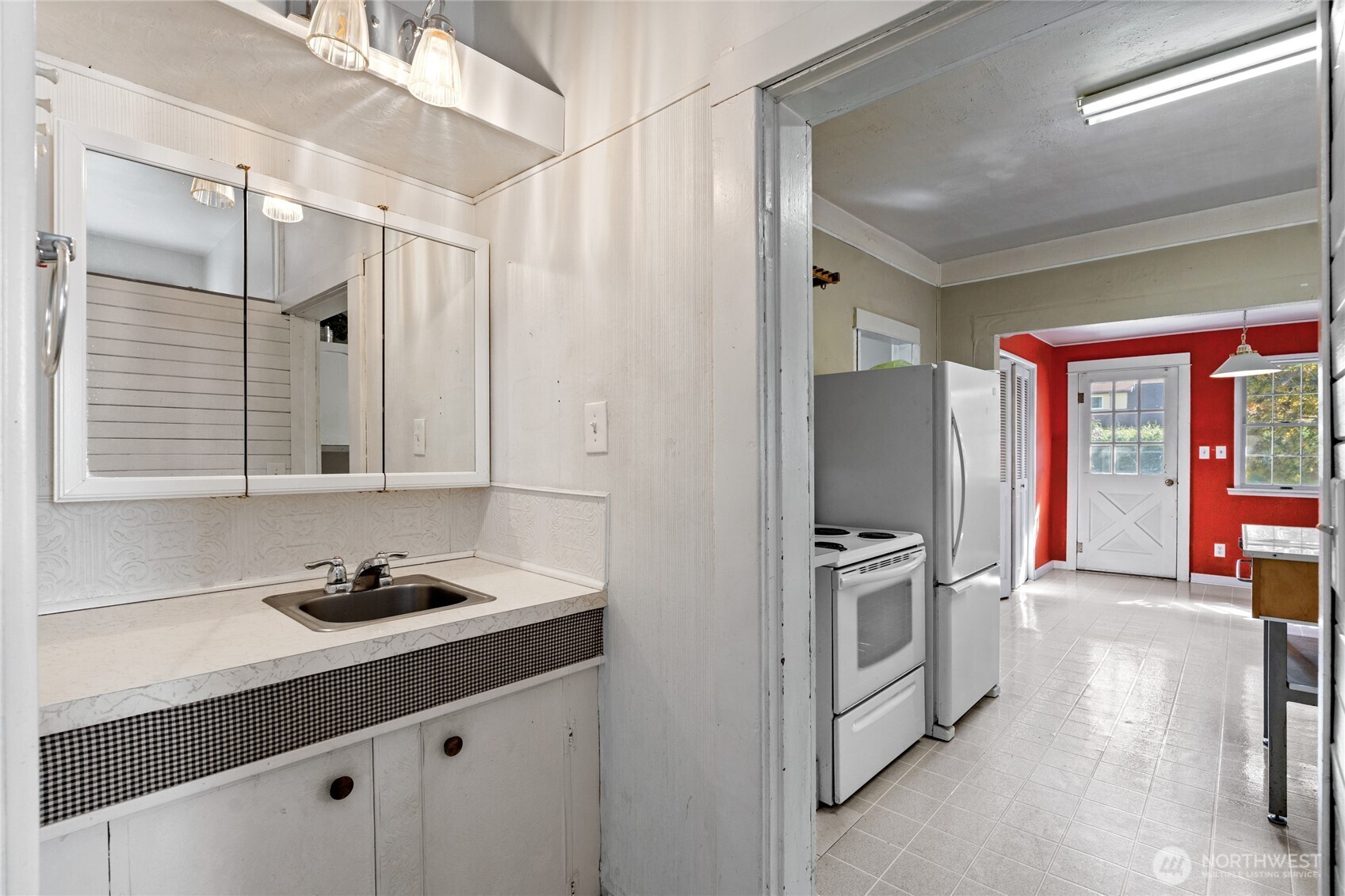 1118 Thompson Street Sumner, WA 98390 - Photo 14 of 39 a kitchen with stainless steel appliances granite countertop a sink and a refrigerator