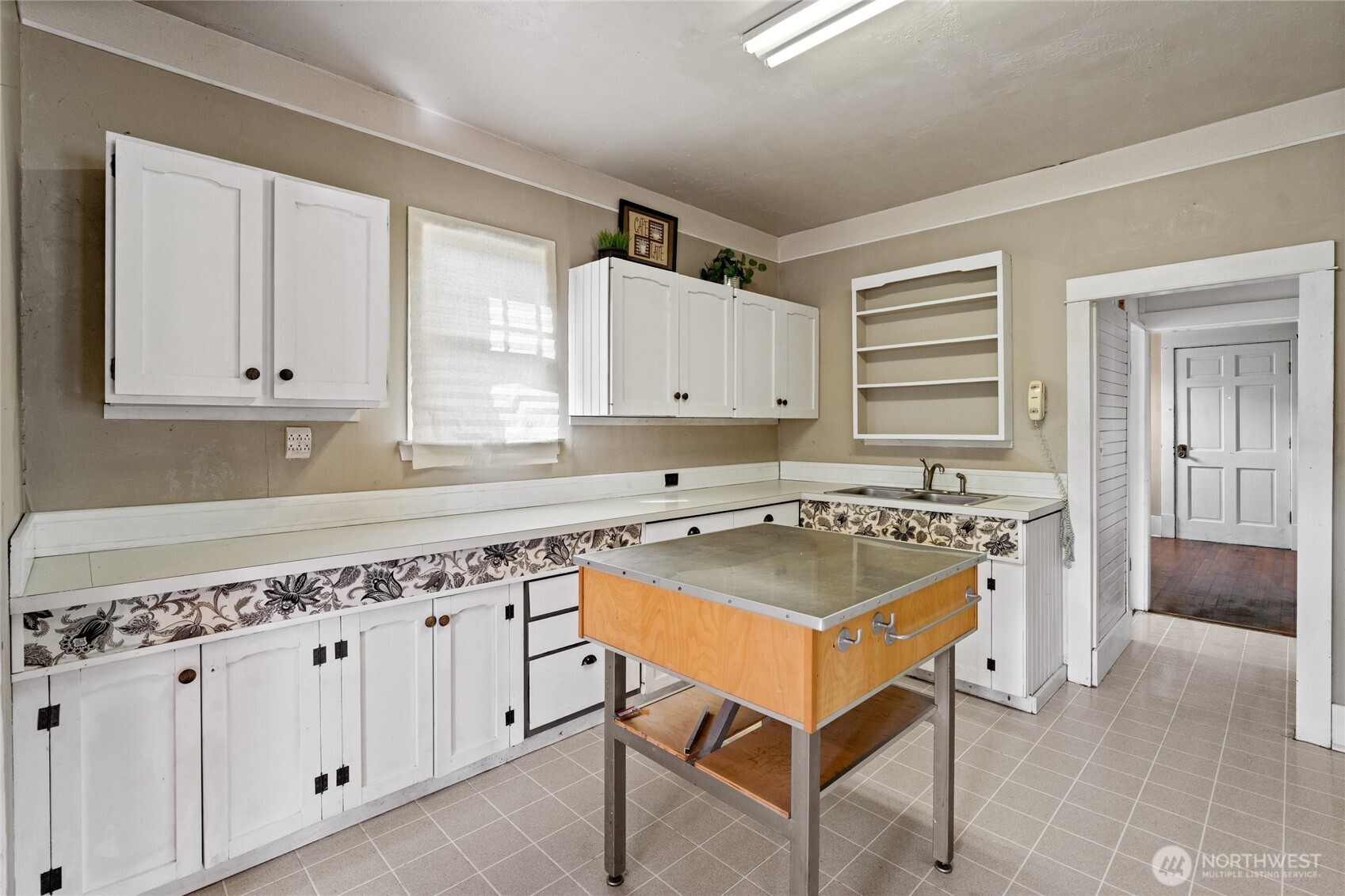 1118 Thompson Street Sumner, WA 98390 - Photo 16 of 39 a kitchen with cabinets appliances a sink and a counter top space
