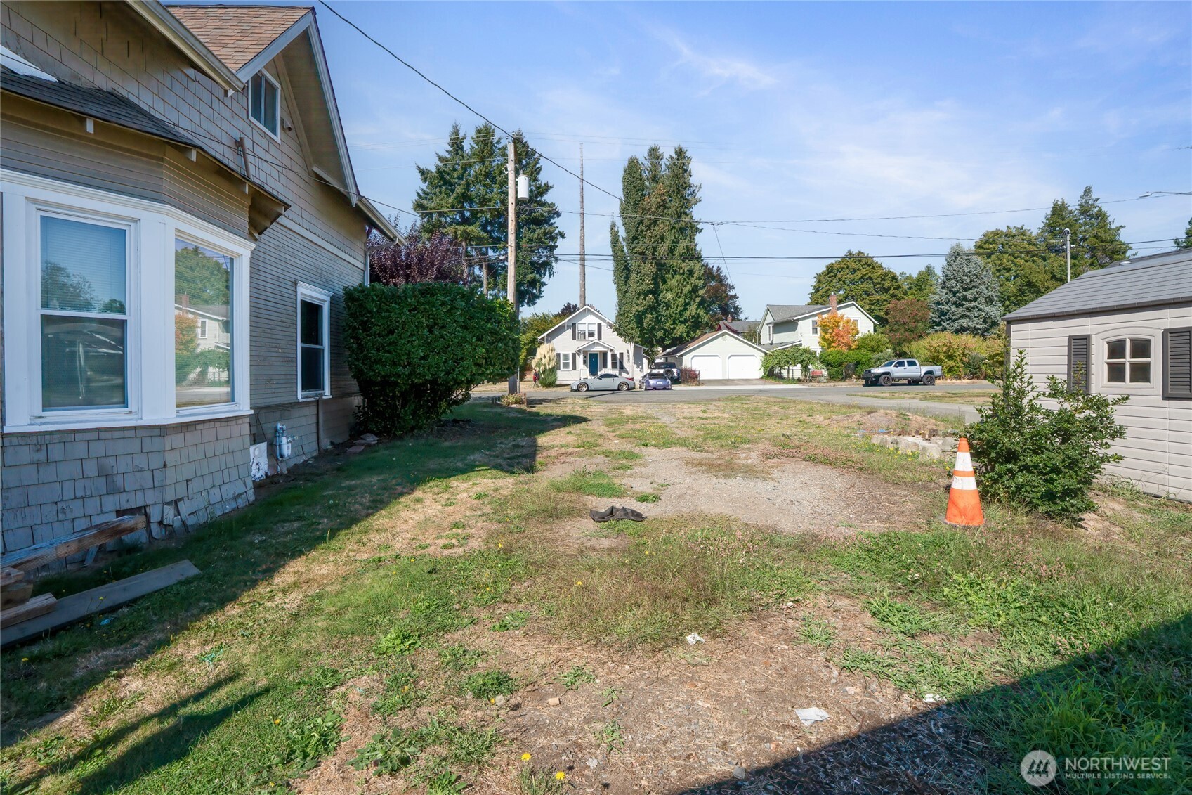 1118 Thompson Street Sumner, WA 98390 - Photo 31 of 39 a view of a house with backyard and sitting area