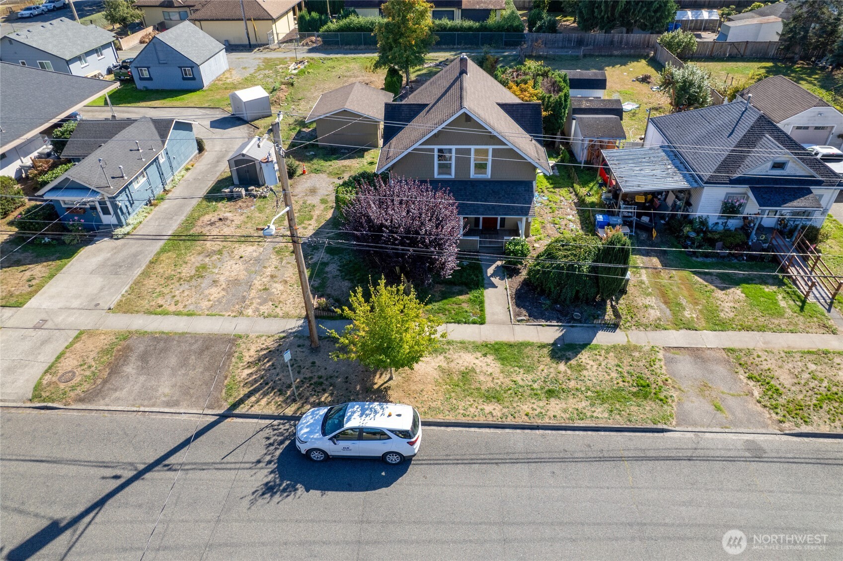 1118 Thompson Street Sumner, WA 98390 - Photo 34 of 39 a front view of a house with a yard and patio