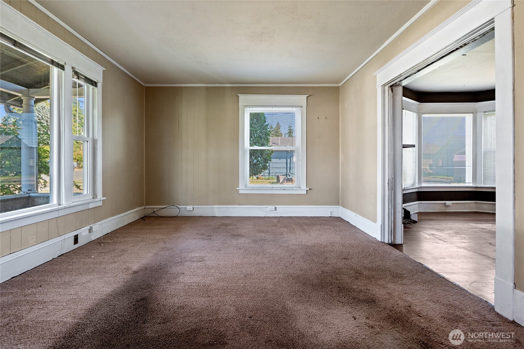 1118 Thompson Street Sumner, WA 98390 - Photo 5 of 39 a view of a livingroom with a fireplace and a window