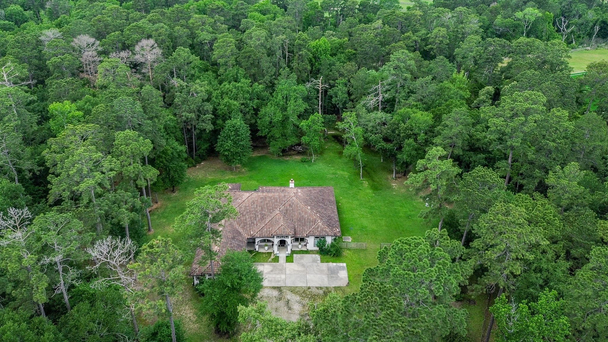 Welcome to your serene and private property that spans 5.92 acres