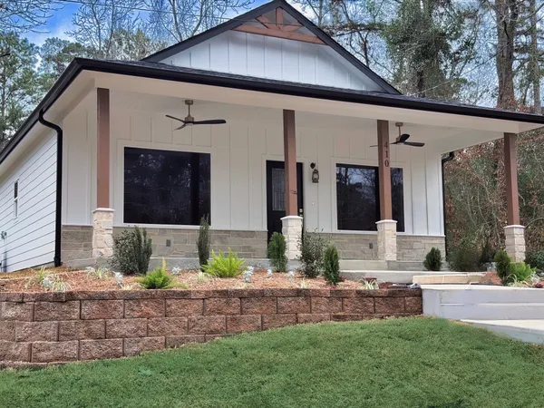 a front view of a house with garden