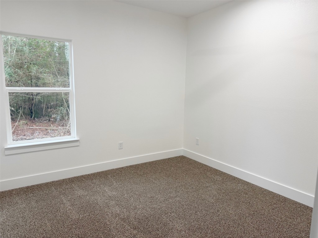 410 Coast Loop Trinity, TX 75862 - Photo 15 of 30 an empty room with a window